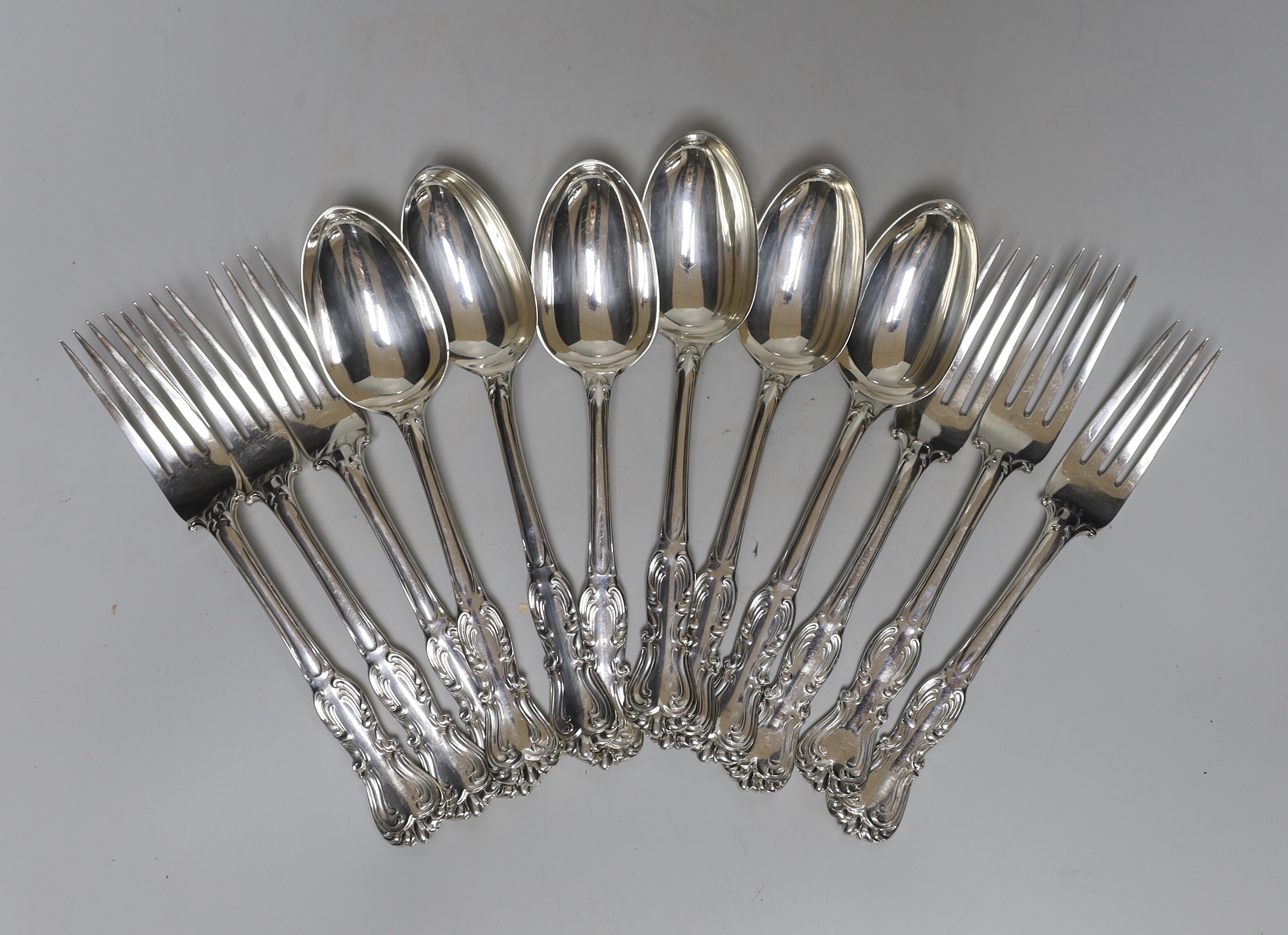 A set of six Victorian silver fancy pattern table spoons and four table forks by John Samuel Hunt, London, 1864 and two similar table forks by George Adams, London, 1848, 37.2oz.